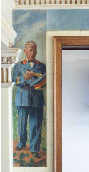 George Washington mural of janitor Wallace Alsop standing in his blue uniform, dusting off his matching cap.